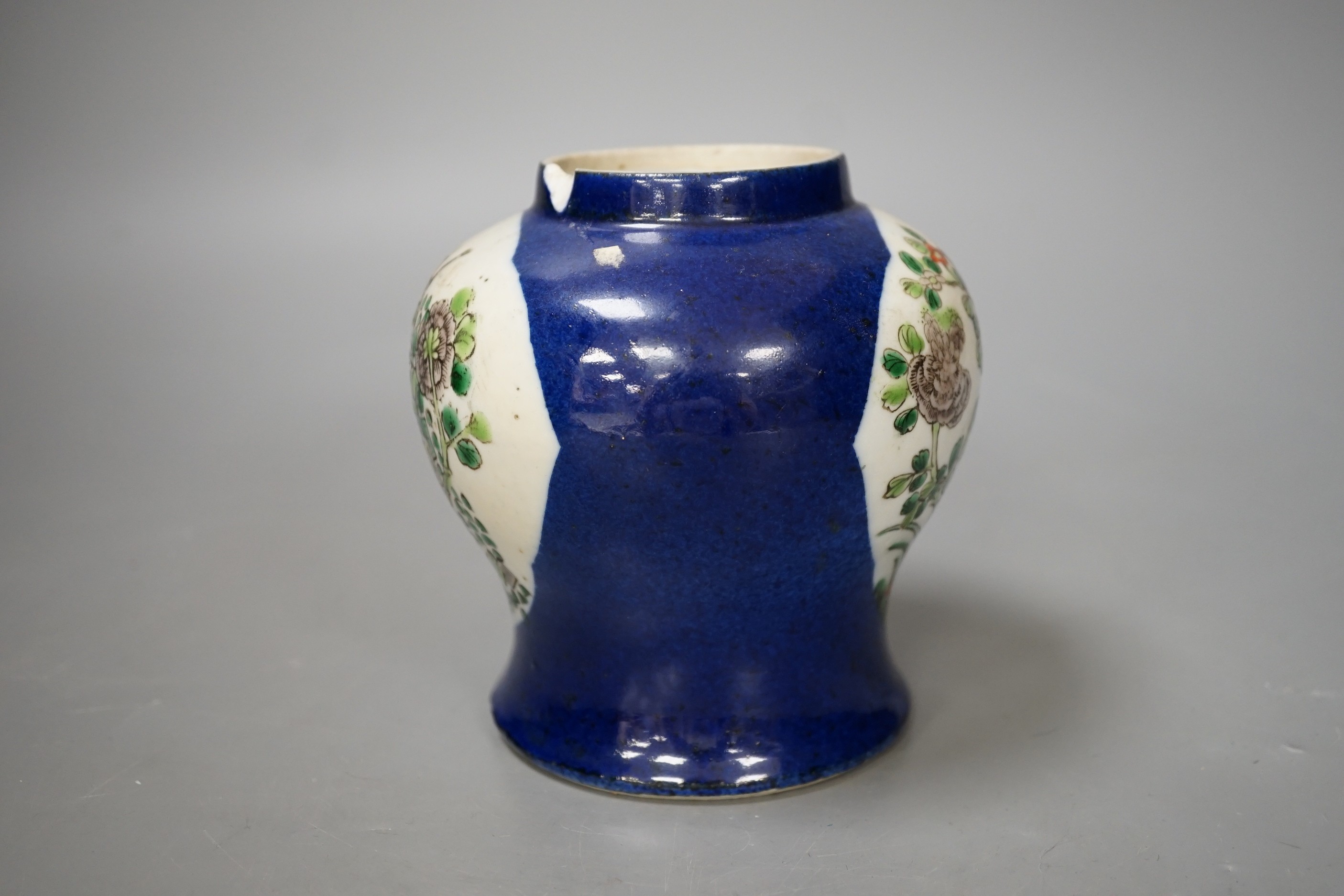 A Chinese powder blue vase, late 19th century, with panelled floral decoration (a.f.). 12cm high